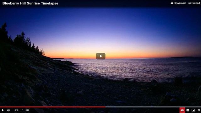 Screen capture of a video frame of the rocky Atlantic coastline at sunrise
