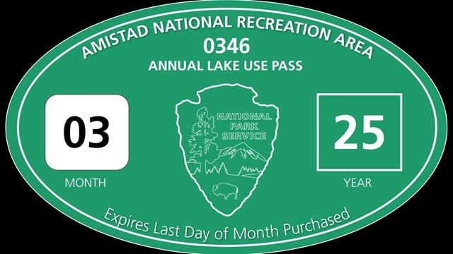 Photo of Annual Lake Use Pass stickers with large oval for boat and smaller rectangle for trailer.