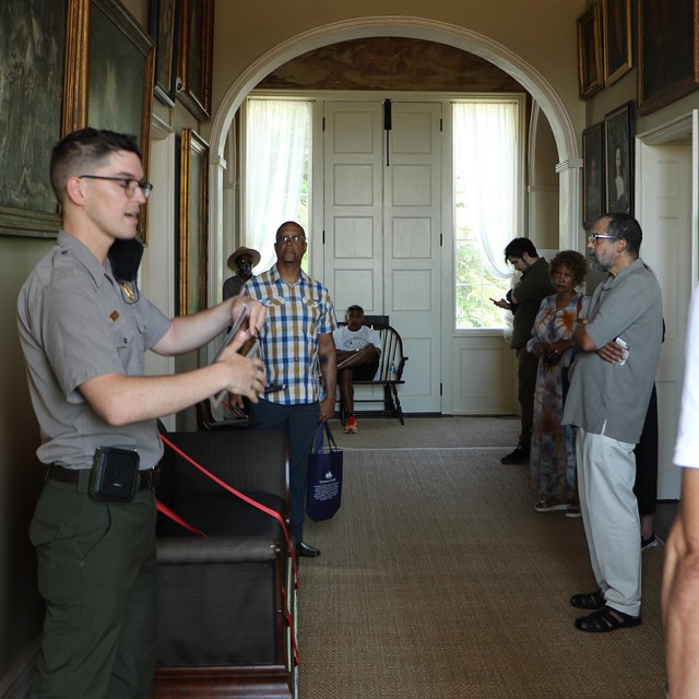 A ranger talking to visitors.