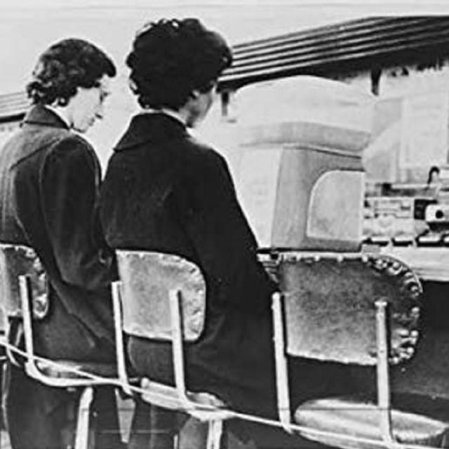 Two women, one Black, one white sitting at lunch counter together in protest. Library of Congress. 