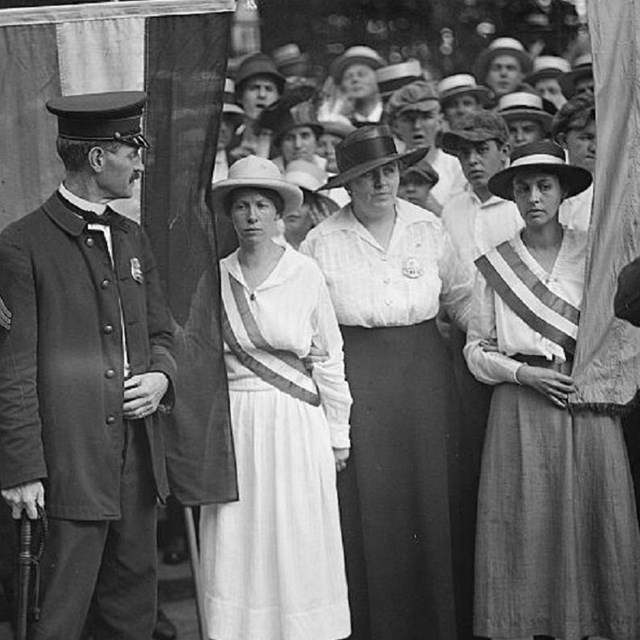 Group of suffragists picketing. 