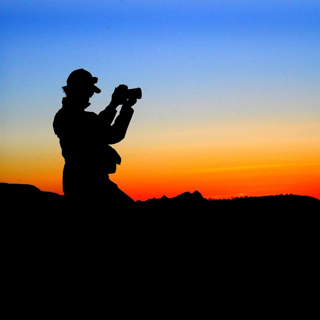 Silhouette of photographer after sunset.