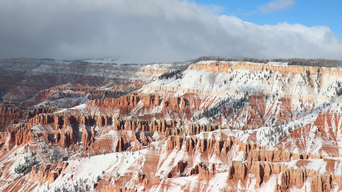 A small amount of snow on the red rocks of the park's geologic amphitheater. 