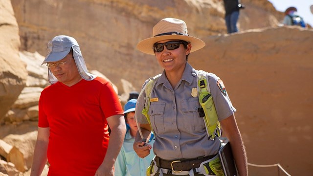 A staff member leading a tour at Pueblo Bonito.