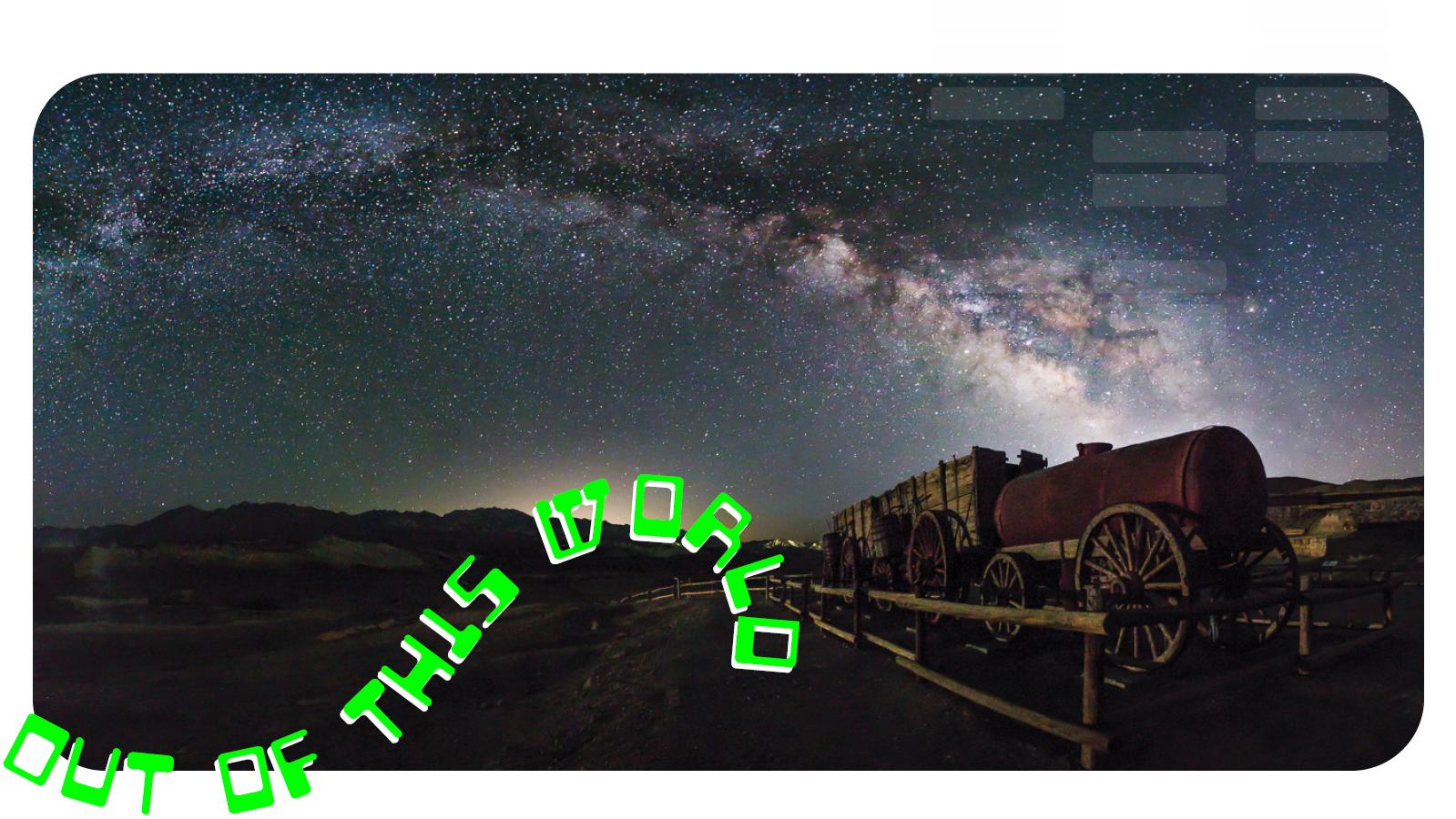 Night image with red light illuminating a wooden fence and historic wagon. Text "Out of this world".