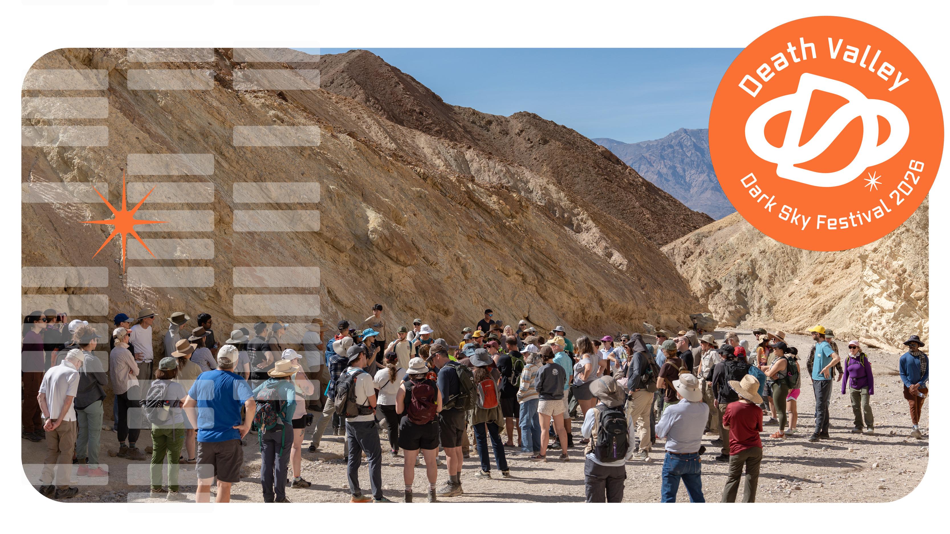 A crowd in a desert canyon.