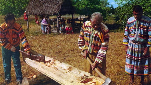 Florida Seminoles make a dugout canoe