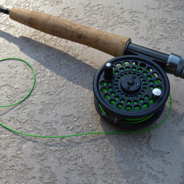 Close up of rod, reel, and line for fly fishing. 