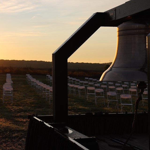 Two large bells known as the Bells of Remembrance sit in the field below the visitor center.