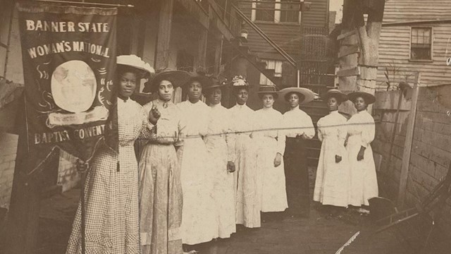 A black and white photograph of African American suffragists.