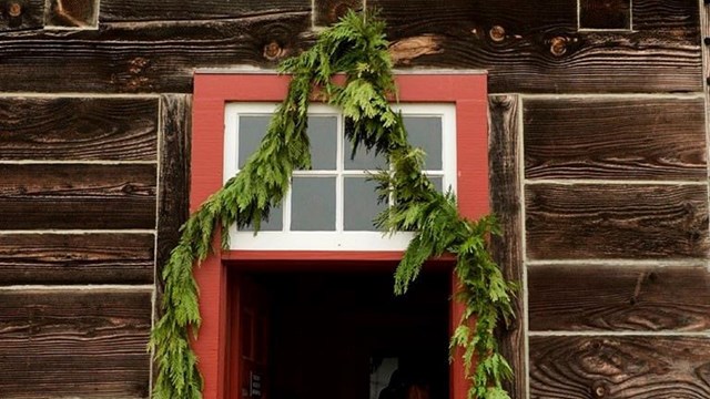 A garland hanging over a doorway at Fort Vancouver.