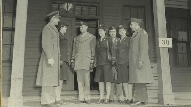 A black and white photo of three members of the Womens Army Corps at Fort Washington