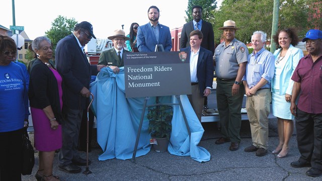 Dignitaries dedicating the official Freedom Riders National Monument sign.