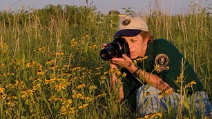 Volunteer photographing flowers