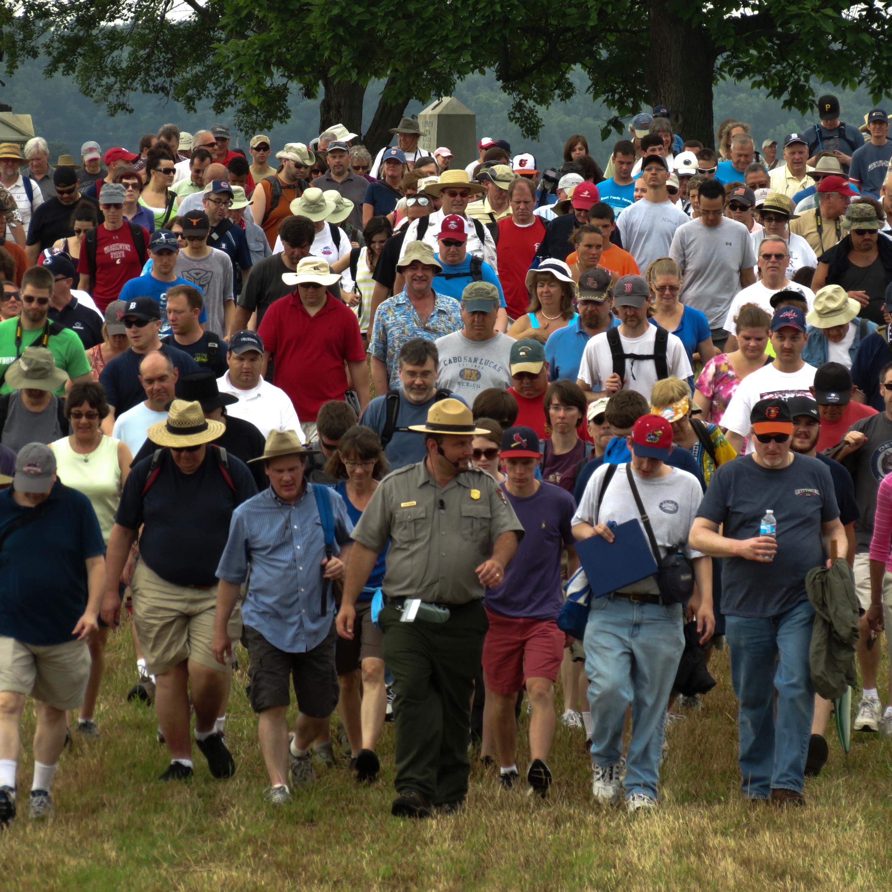 A park ranger leads a large group on one of the many ranger programs held throughout the year.