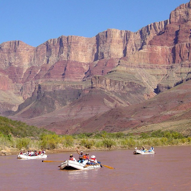 A commercial raft trip in oar boats on the Colorado River through Grand Canyon National Park.