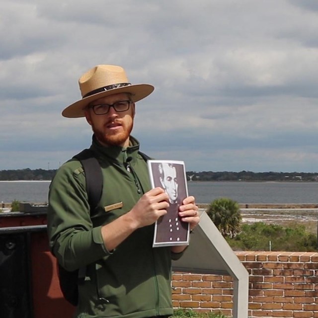 A ranger talks to visitors about park resources
