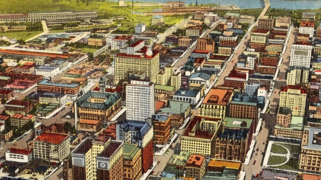 Skyline view of Omaha's business district, postcard dated circa 1930-45. Links to Travel Omaha.