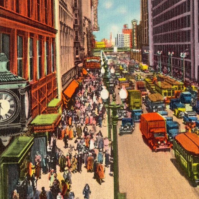 Postcard of historic Chicago street with cars and shops lining the street.