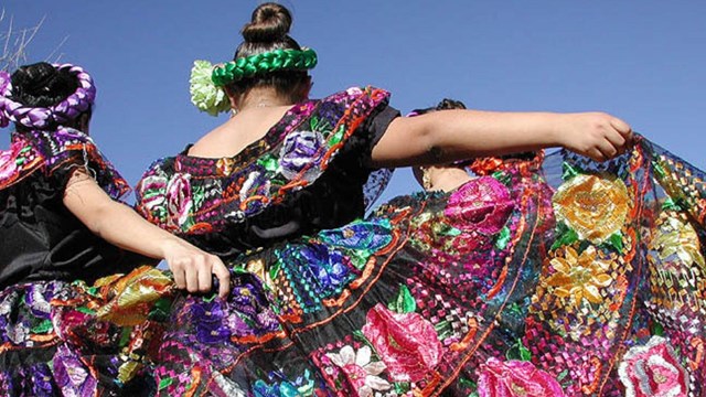 Folklórico dancers at La Fiesta de Tumacácori, girls in colorful floral skirts
