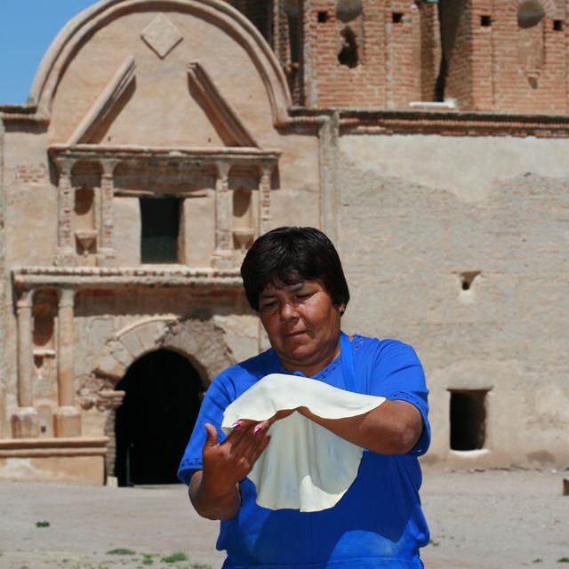 Person holding a tortilla to demonstrate 