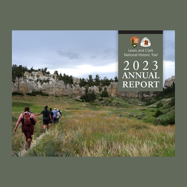 Cover of horizontal document, cover has large photo of people hiking. Annual Report 2023