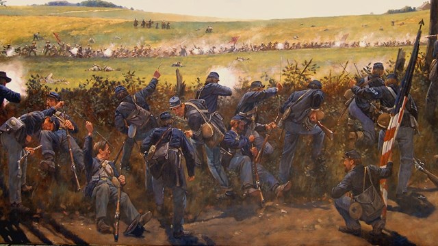 A Painting showing union soldiers in the foreground defending against a Confederate attack 