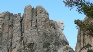 Close up photo of the eyes of Theodore Roosevelt on Mount Rushmore.