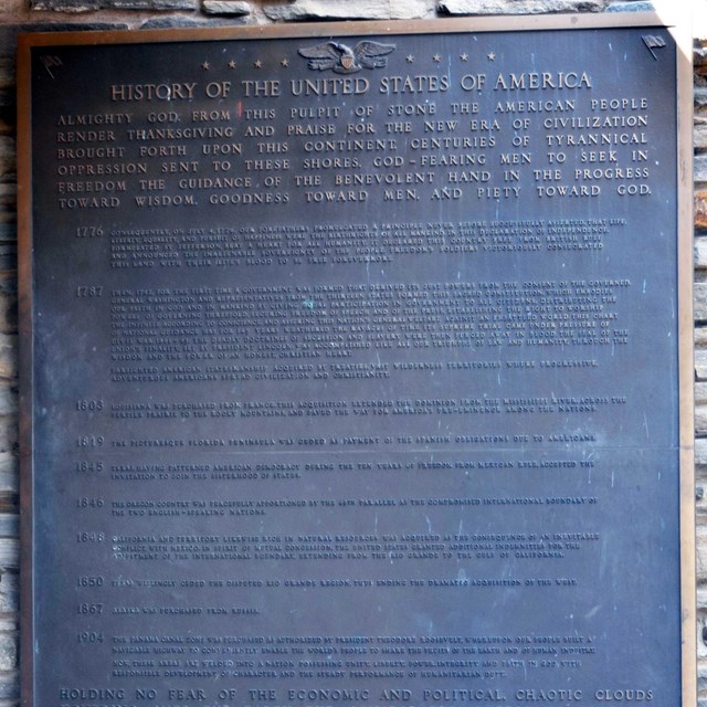Photo of a plaque inscribed with the winning essay.