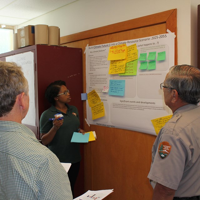 National Park Service staff looking at a planning board