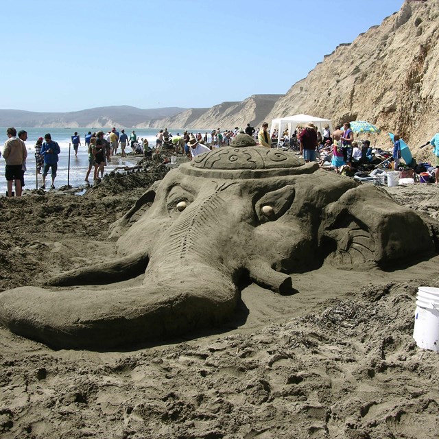 A sand sculpture of the head of the Hindu god Ganesha.