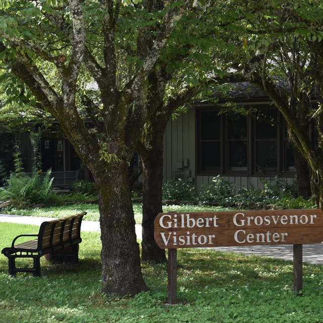 A sign shows the entrance to the visitor center.
