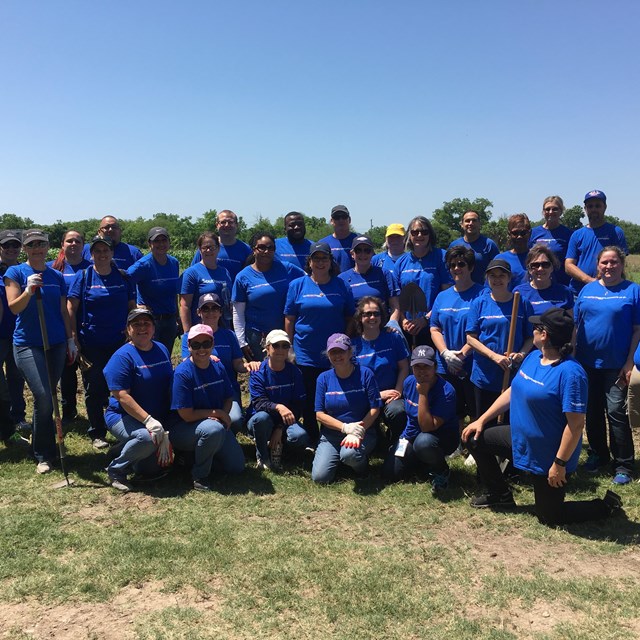 Volunteer group from Southwest Airlines poses for a group photo at San Antonio Missions NHP.