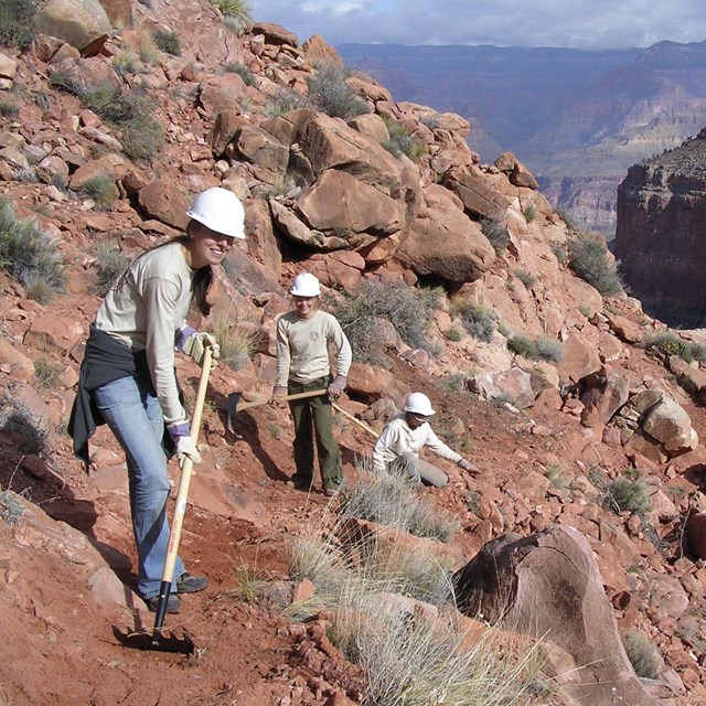 ACE crew members work on a trail in the Grand Canyon.