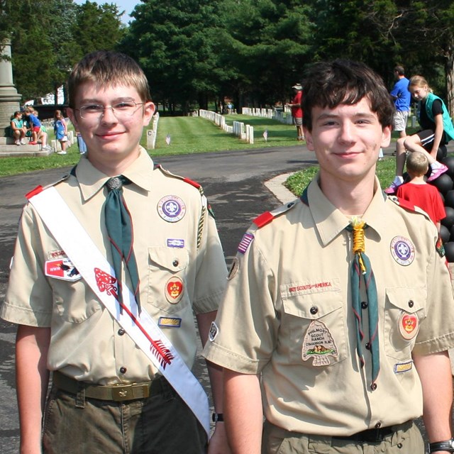 Four Boy Scouts stand in a line