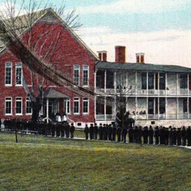 Postcard of boarding school building. 