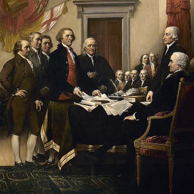 Men signing a document. Artist: John Trumbull, CC0