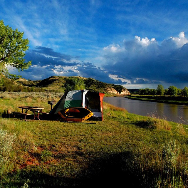 A tent site alongside the Little Missouri River.