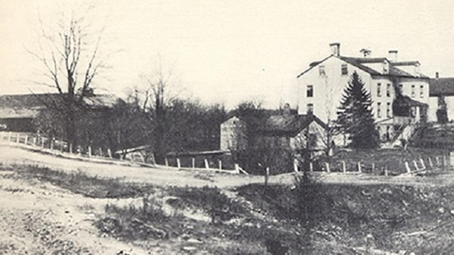 historic photo of a building in a rural setting