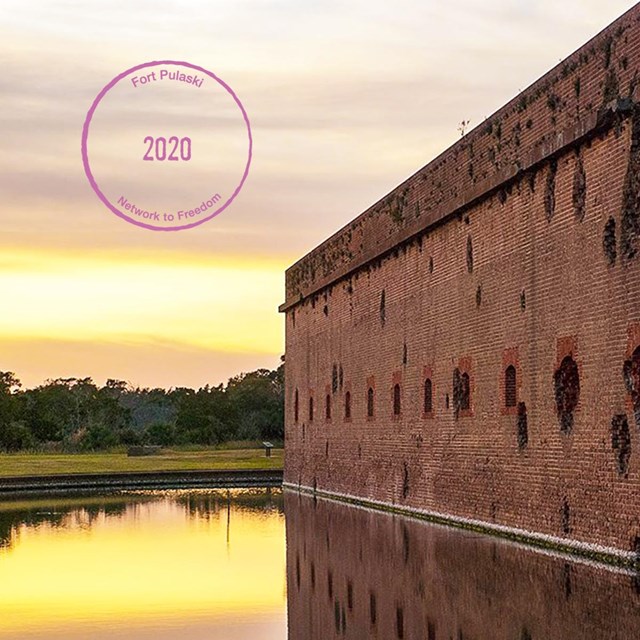 A photograph of Fort Pulaski with a Digital Passport® Stamp in the left hand corner.