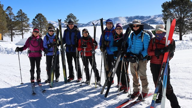 A group of cross-country skiers getting ready for a ski tour.