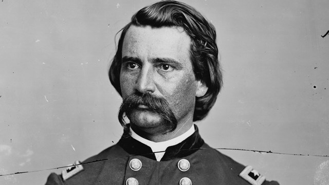 A black and white image of John Logan standing in Union generals uniform.