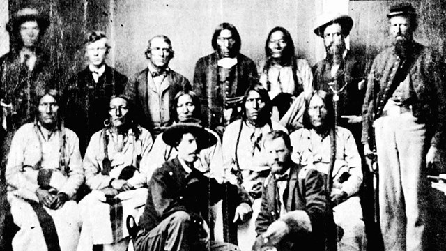 black and white historical photograph of the chiefs of several plains tribes and US representatives