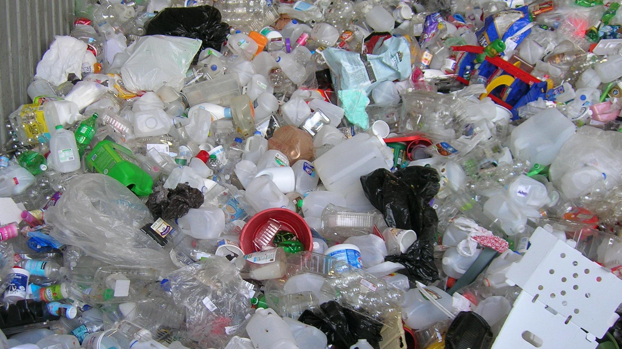 Used plastics awaiting bundling at the recycling center.