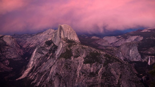 Pink skies with Half Dome and Nevada Fall as seen from Glacier Point