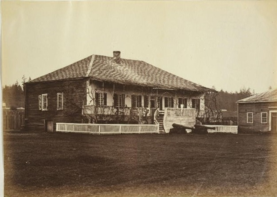 The reconstructed Chief Factor's House at Fort Vancouver. A white, two-story house with a long veranda along its front side.