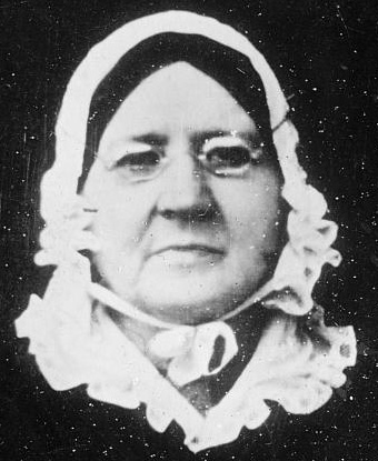 Photograph of Mary Pickersgill: small glasses, black hair, white bonnet
