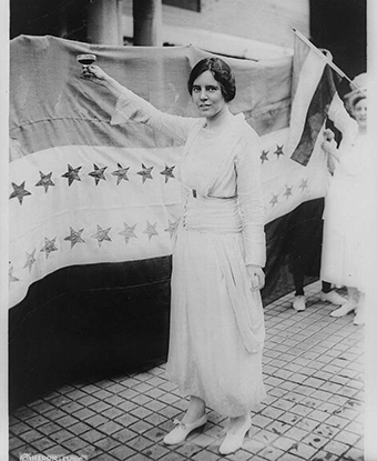 Alice Paul raises a glass after the 19th Amendment passes. Library of Congress