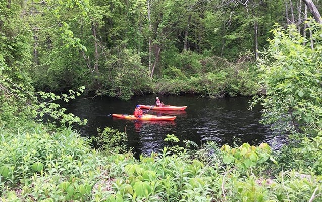 Paddlers on the river in the Blackstone Heritage Corridor