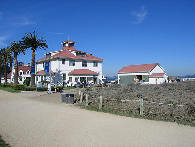 U.S.C.G. Fort Point building lined with Canary Island date palms on the southwest edge of the site. 